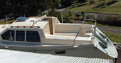 Roberts 370 Gallery - The cockpit area with the swim platform and gas bottle recesses.