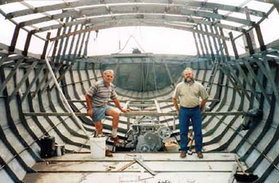 Roberts 53 Gallery - multi chine steel yacht - inside the hull with engine in place