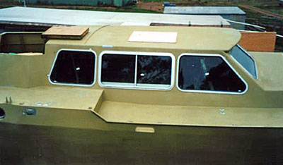 Roberts 53 Gallery - multi chine steel yacht - salon windows fitted